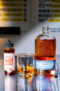 Read more about the article Bulleit Frontier Whiskey and Mike’s Hot Honey Collab On The Ultimate Pairing: A Drizzle + A Pour